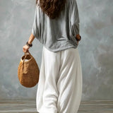 Top con spalle scoperte e pantaloni a lanterna